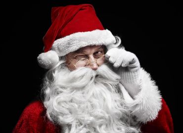 man-in-santa-claus-costume-winking_web.jpg